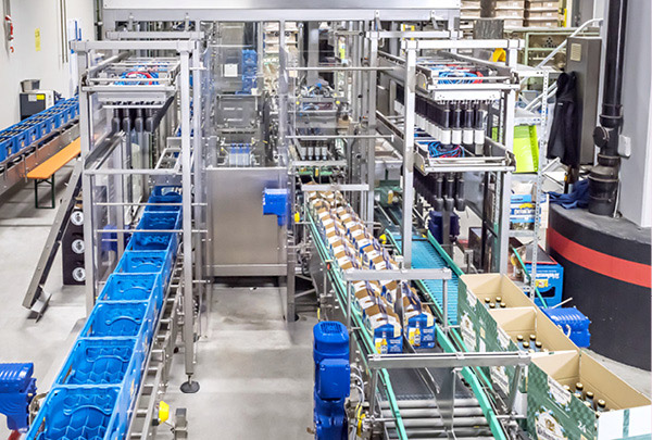 Repacking of bottles into open basket and carton